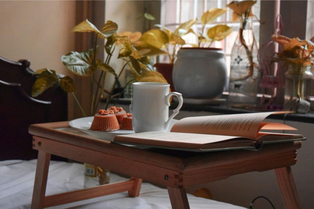 Thrifted wooden table in a sustainable living room on a budget”

